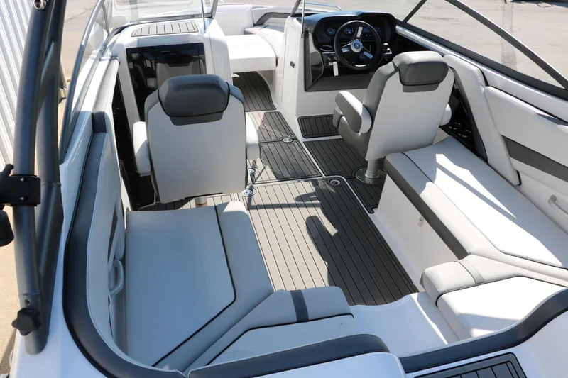 Slide: The Image of 2018 Yamaha Boats AR240 HO interior with sleek seating and modern dashboard design. - 14