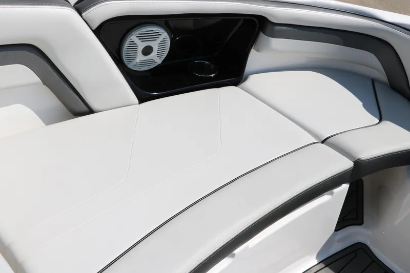 Slide: The Image of 2018 Yamaha Boats AR240 HO interior seating with speaker and cup holder. - 22