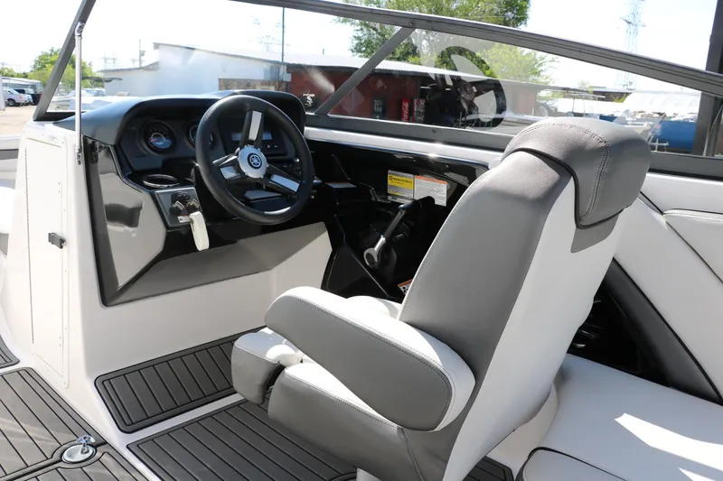 Slide: The Image of 2018 Yamaha Boats AR240 HO cockpit with steering wheel and captain's chair. - 25
