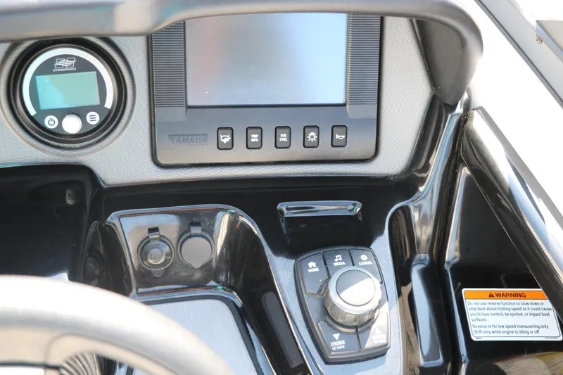 Slide: The Image of Control panel of 2018 Yamaha Boats AR240 HO with digital display and controls. - 28