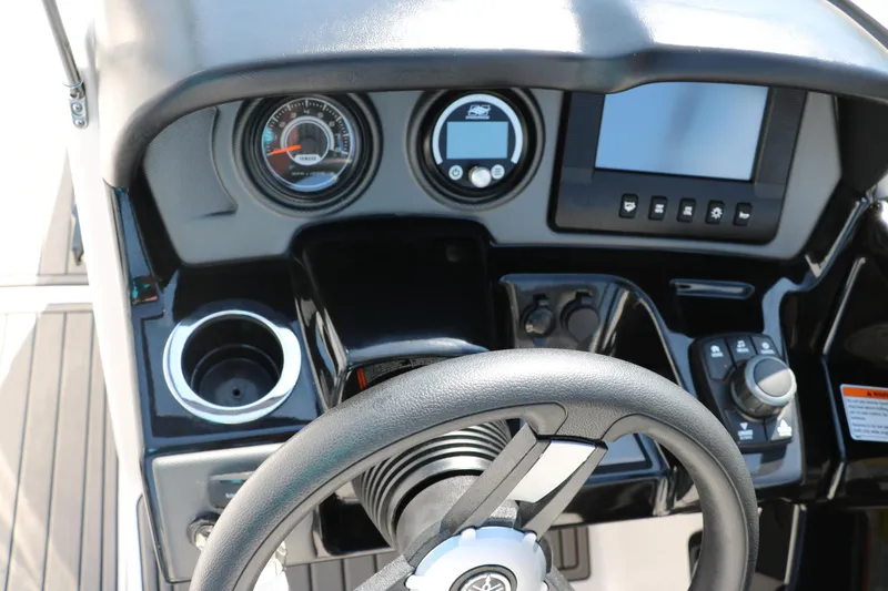 Slide: The Image of 2018 Yamaha Boats AR240 HO dashboard with steering wheel, gauges, and controls. - 29