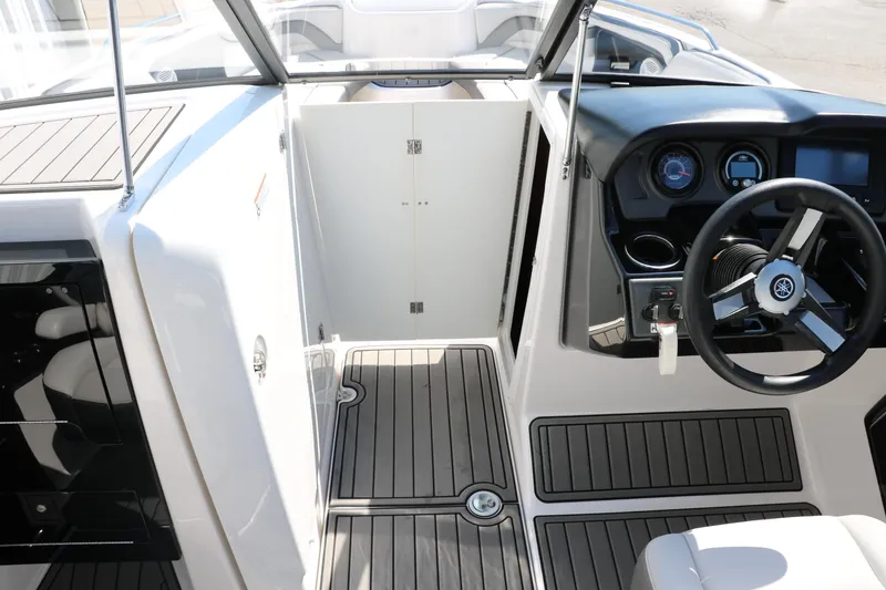 Slide: The Image of 2018 Yamaha Boats AR240 HO interior with steering wheel and dashboard. - 35
