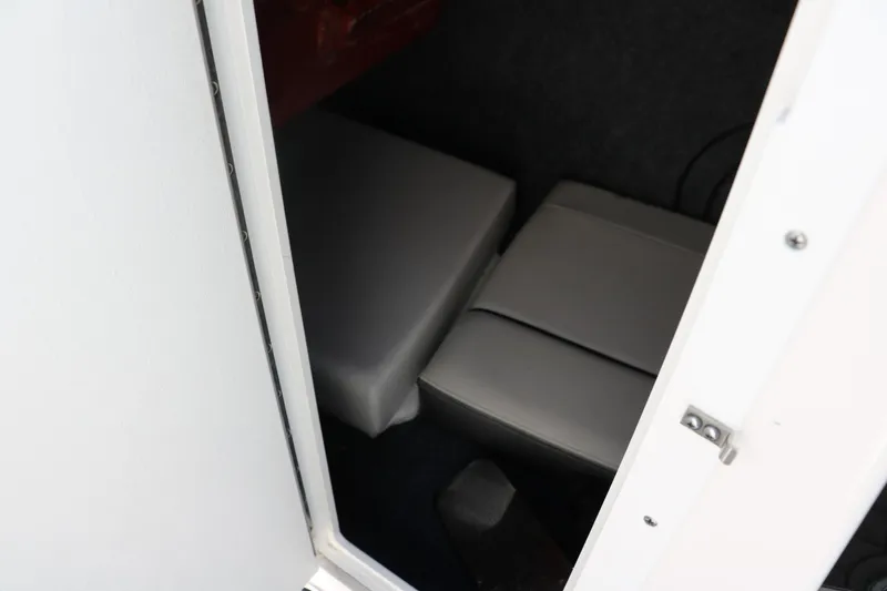 Slide: The Image of 2018 Yamaha Boats AR240 HO interior cabin with cushioned seating. - 36
