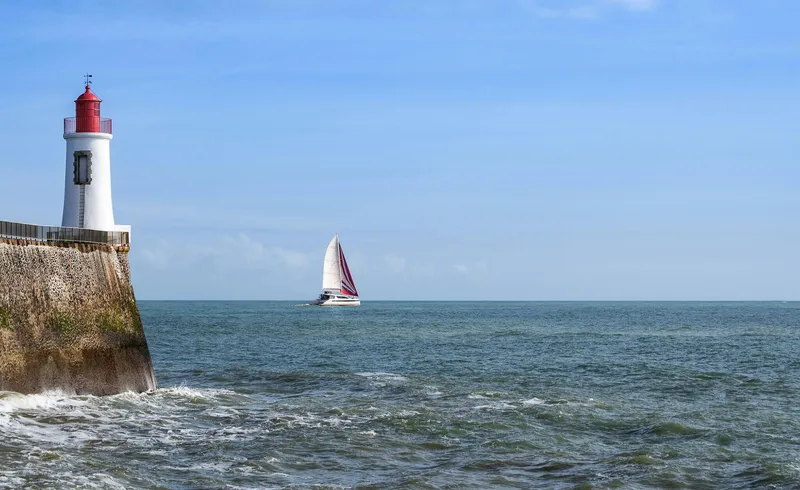 Slide: The Image of Sailboat "Privilege Signature 510" near lighthouse on open sea, 2025 model. - 12