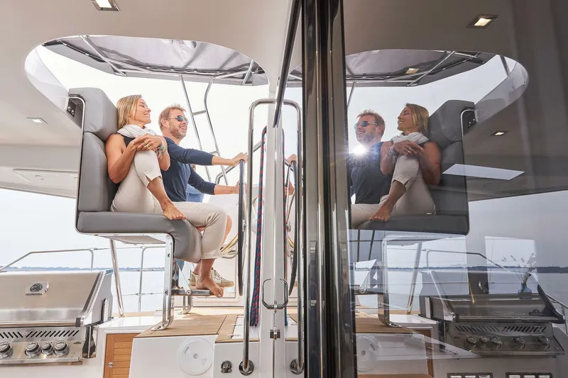 Slide: The Image of Couple relaxing on Privilege Signature 510 yacht, 2025 model, enjoying a sunny day at sea. - 15