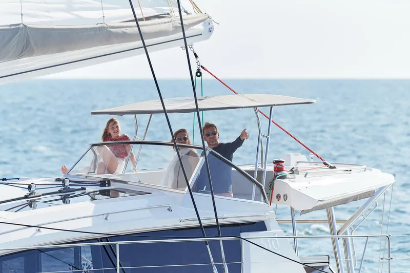 Slide: The Image of People enjoying a sail on a 2025 Privilege Signature 510 yacht. - 16