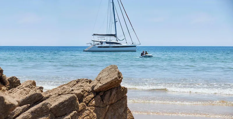 Slide: The Image of Sailing yacht Privilege Signature 510 anchored near rocky shore, 2025 model. - 21