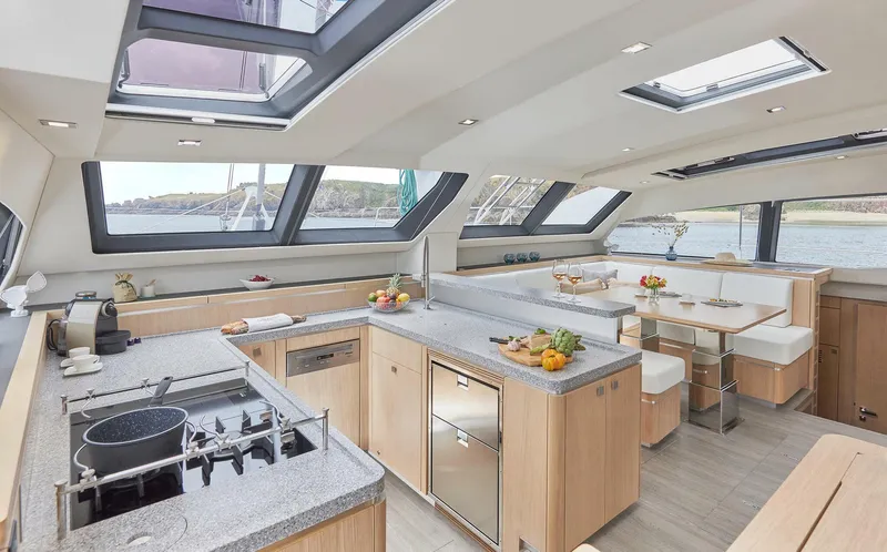 Slide: The Image of Luxurious interior of 2025 Privilege Signature 510 yacht with modern kitchen and dining area. - 30
