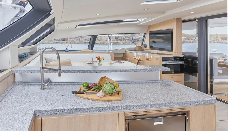 Slide: The Image of Luxurious interior of 2025 Privilege Signature 510 yacht with modern kitchen and dining area. - 32