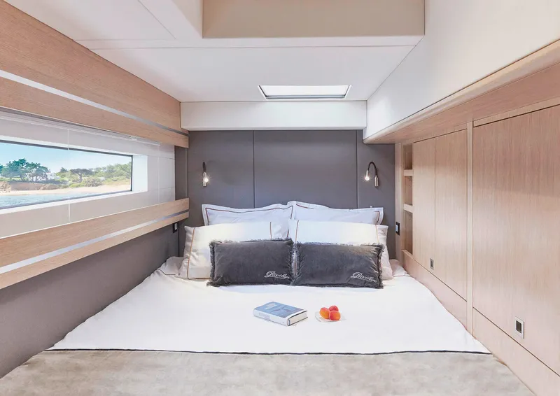 Slide: The Image of Luxurious bedroom interior of 2025 Privilege Signature 510 yacht with modern design and natural light. - 38
