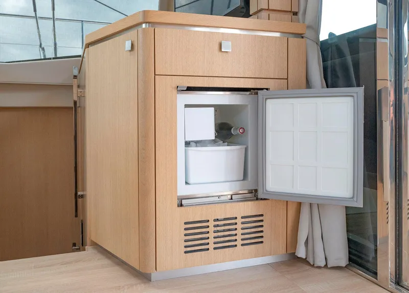 Slide: The Image of Compact fridge in 2025 Privilege Signature 510 yacht interior, open with bottle inside. - 43
