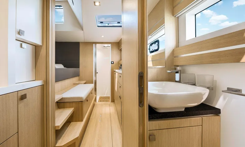 Slide: The Image of Luxurious interior of 2025 Privilege Signature 510 yacht with modern wood finishes and skylight. - 44