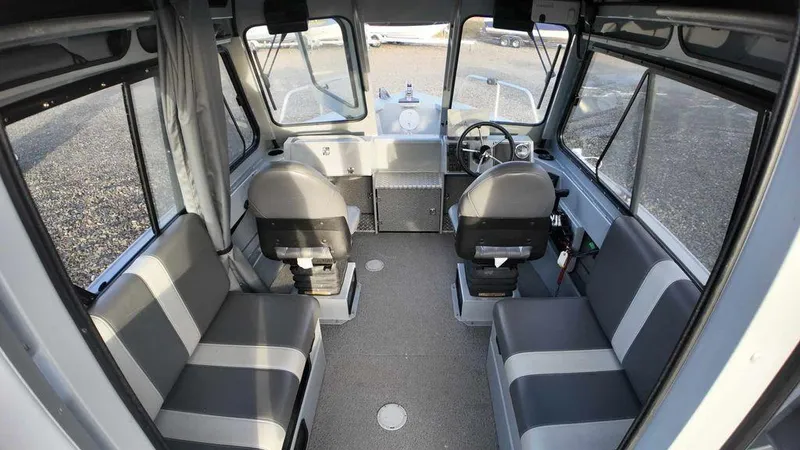 Slide: The Image of 2018 Hewescraft 210 Sea Runner interior with seating and steering console. - 7