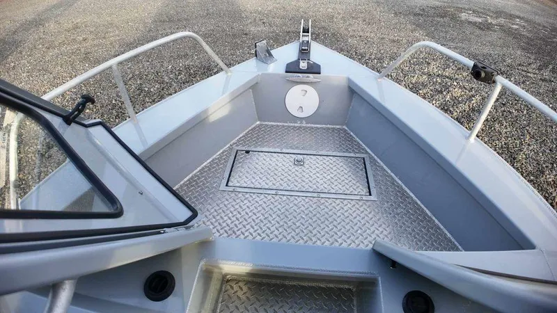 Slide: The Image of 2018 Hewescraft 210 Sea Runner boat deck with diamond plate flooring and railing. - 8