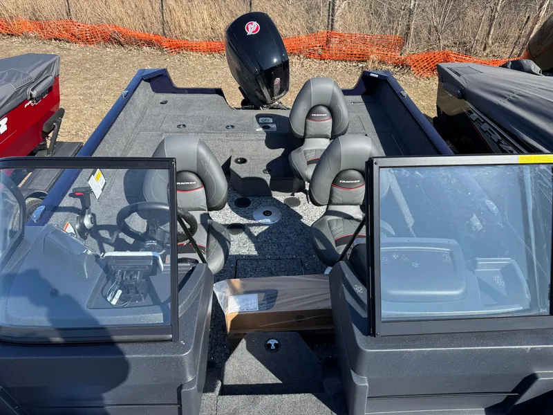 Slide: The Image of 2025 Tracker Pro Guide V-175 WT boat interior with seating and steering console. - 5