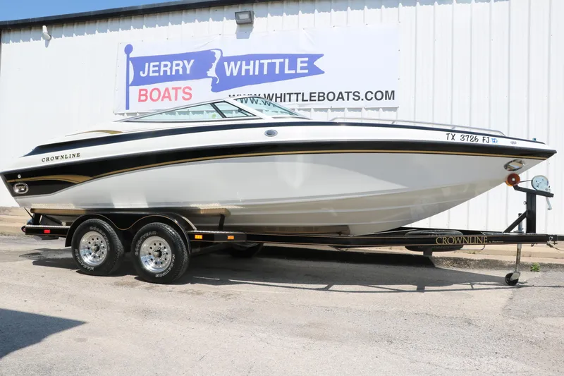Slide: The Image of 2001 Crownline 225 BR boat on trailer at Jerry Whittle Boats dealership. - 1