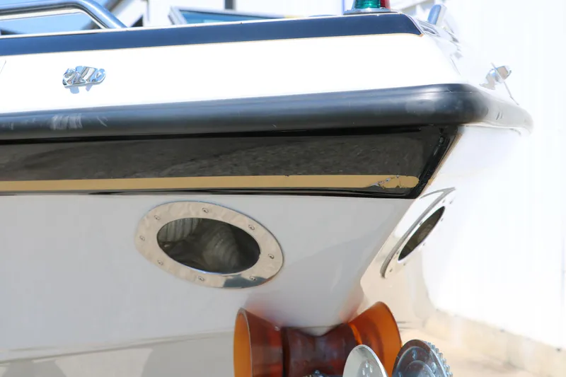 Slide: The Image of 2001 Crownline 225 BR boat bow with sleek design and chrome details. - 10