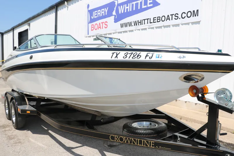 Slide: The Image of 2001 Crownline 225 BR boat on trailer at Jerry Whittle Boats dealership. - 11