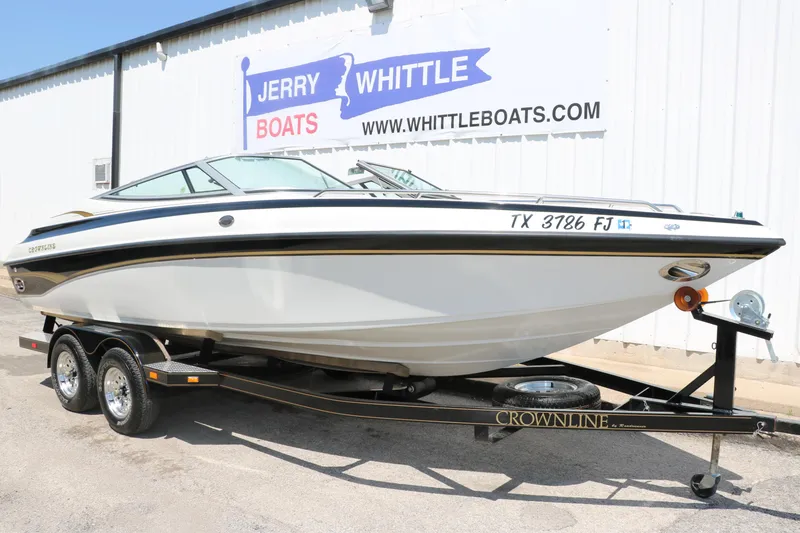 Slide: The Image of 2001 Crownline 225 BR boat on trailer at Jerry Whittle Boats dealership. - 12