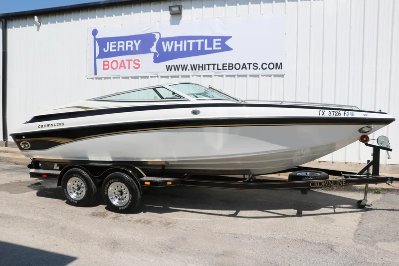 Slide: The Image of 2001 Crownline 225 BR boat on trailer at Jerry Whittle Boats dealership. - 13