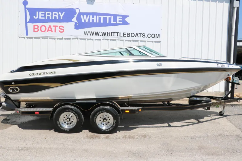 Slide: The Image of 2001 Crownline 225 BR boat on trailer at Jerry Whittle Boats dealership. - 14