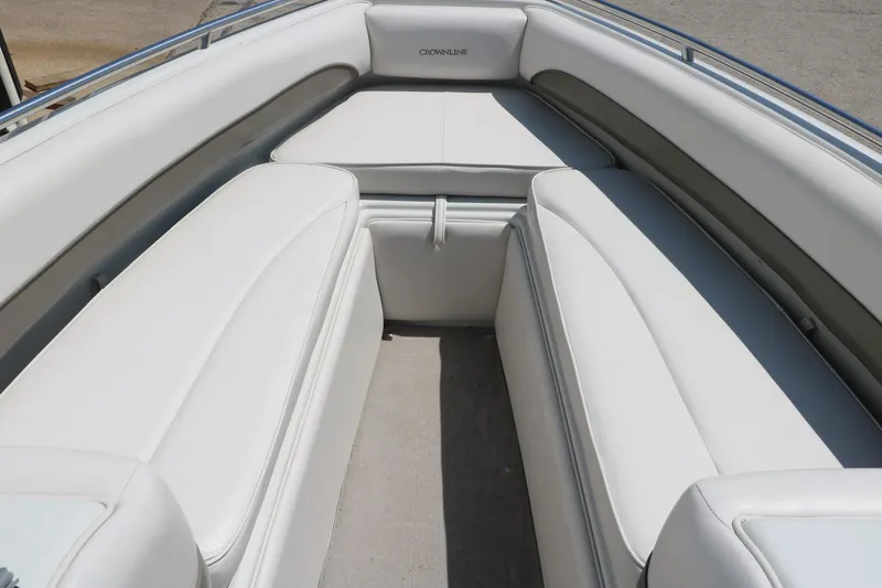 Slide: The Image of 2001 Crownline 225 BR boat interior with white cushioned seating. - 21