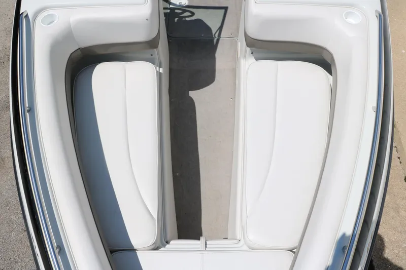 Slide: The Image of 2001 Crownline 225 BR boat interior with white seating and clean design. - 23