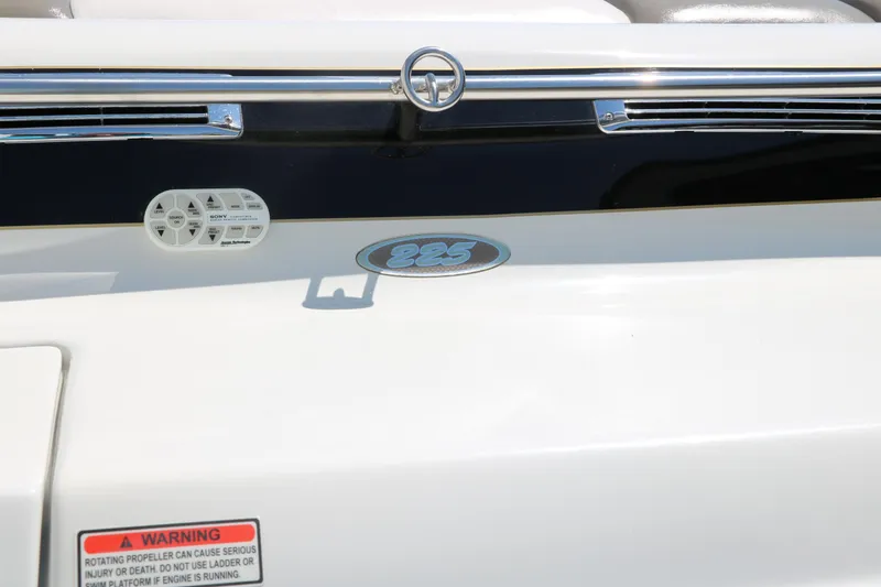 Slide: The Image of 2001 Crownline 225 BR boat detail with logo and warning label. - 32