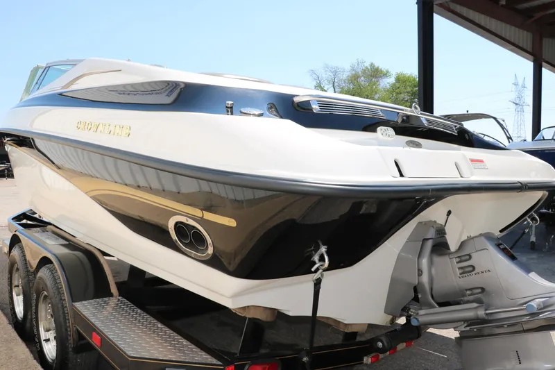 Slide: The Image of 2001 Crownline 225 BR boat on trailer, rear view, under a canopy. - 7