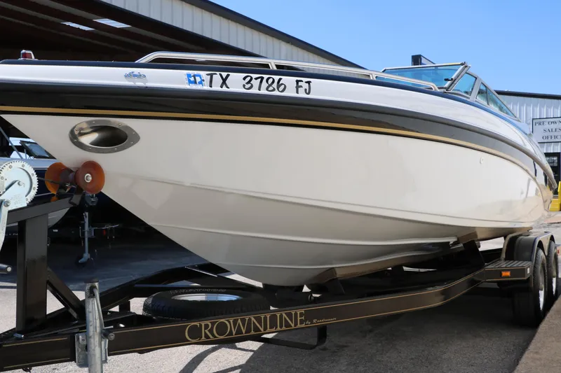 Slide: The Image of 2001 Crownline 225 BR boat on trailer, parked outdoors, side view. - 9
