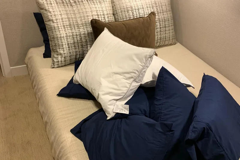 Slide: The Image of A cozy bed with assorted pillows, featuring Adonia Traditions 6 shares, 2020 model. - 12