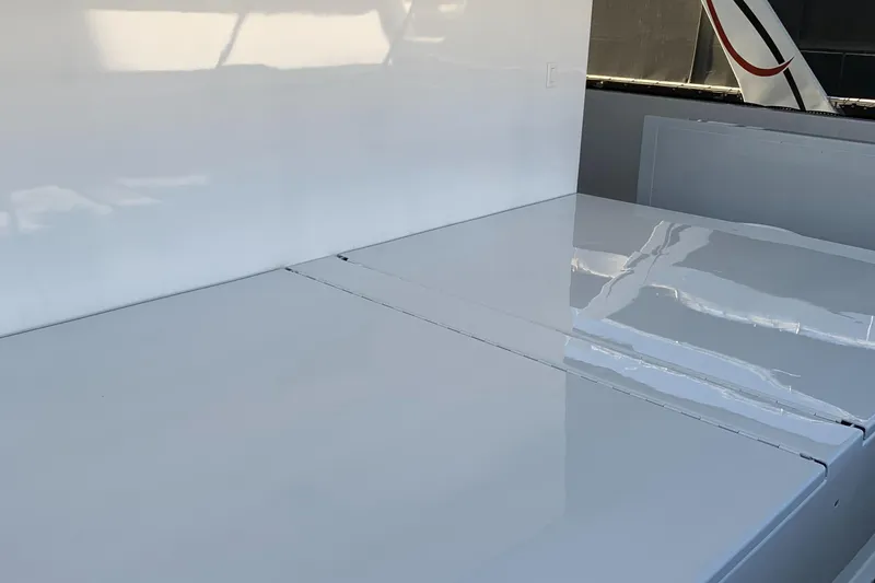 Slide: The Image of Sleek white surface of Adonia Traditions 6 shares, 2020 model, reflecting light. - 13