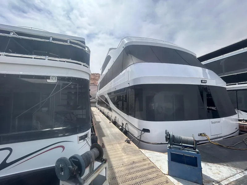 Slide: The Image of Two modern Adonia houseboats docked, model Traditions 6 shares, year 2020. - 3