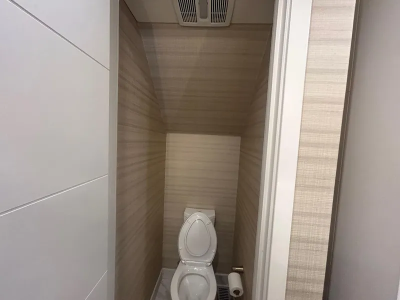 Slide: The Image of Small bathroom with a toilet, beige walls, and ceiling vent, Adonia Traditions 6 shares 2020. - 6