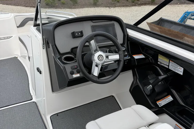 Slide: The Image of 2020 Yamaha Boats SX240 dashboard with steering wheel and controls. - 11