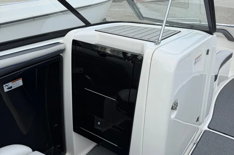 Slide: The Image of 2020 Yamaha Boats SX240 interior detail with sleek black and white design. - 12