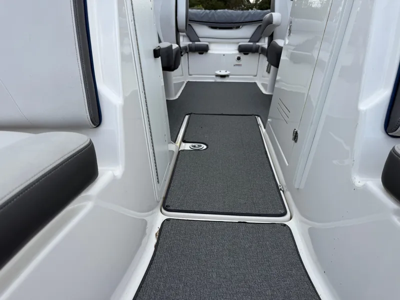 Slide: The Image of 2020 Yamaha Boats SX240 interior with gray carpet and seating. - 6