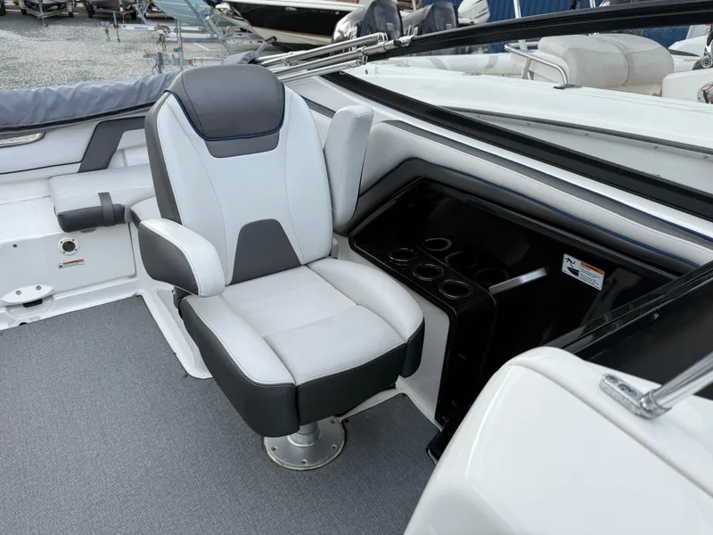 Slide: The Image of 2020 Yamaha Boats SX240 interior with captain's chair and dashboard. - 8