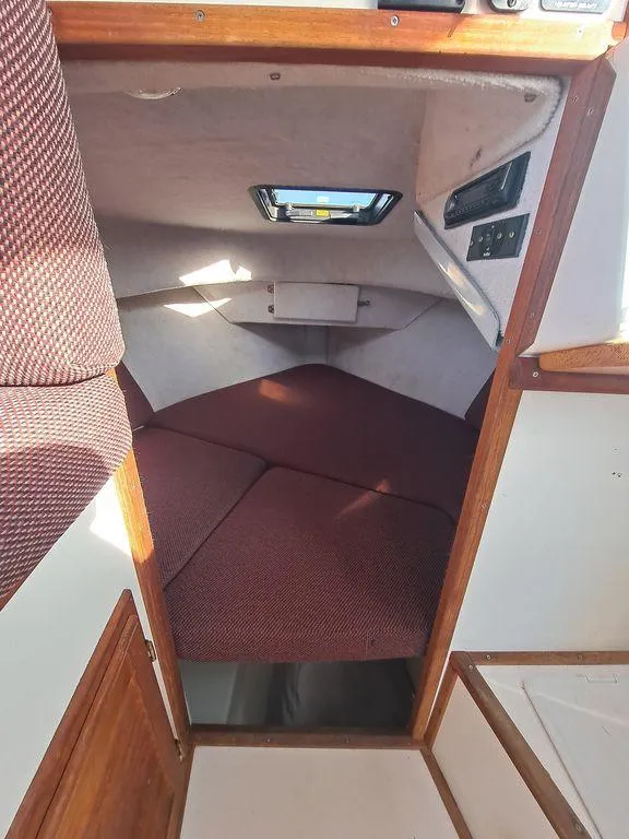 Slide: The Image of Interior cabin of 2000 Osprey 26 Fisherman boat with cozy sleeping area. - 4
