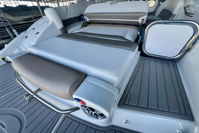 Slide: The Image of 2018 Crownline 285 SS boat interior with seating and speaker system. - 11