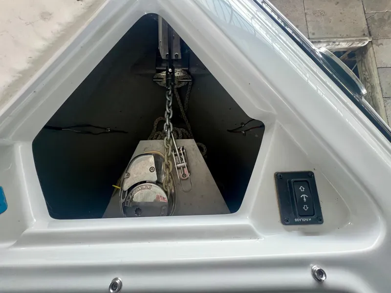 Slide: The Image of Anchor compartment of 2018 Crownline 285 SS boat with winch and control panel. - 32
