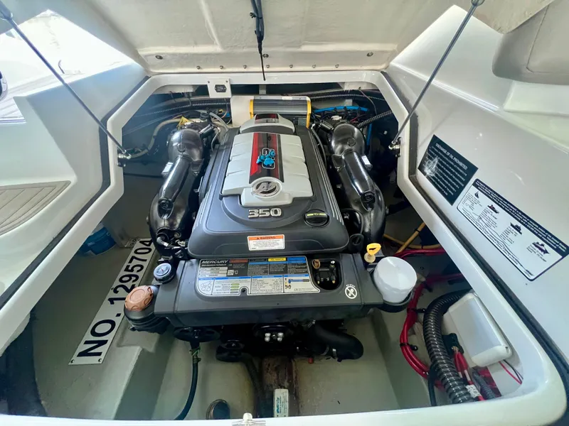 Slide: The Image of Engine compartment of a 2018 Crownline 285 SS boat, showcasing a powerful 350 engine. - 36