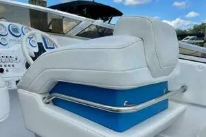 Slide: The Image of White boat seat with blue base and steering wheel, Profile 33 V, 2002 model. - 12