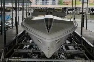 Slide: The Image of 2002 Profile 33 V boat docked in a marina, front view. - 14