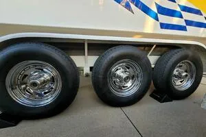Slide: The Image of Triple axle trailer with chrome wheels for 2002 Profile 33 V boat. - 16