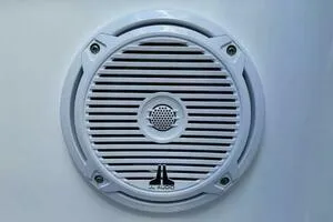 Slide: The Image of White circular speaker grille on a Profile 33 V, 2002 model. - 17