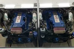 Slide: The Image of Twin blue engines in a 2002 Profile 33 V boat, showcasing powerful performance. - 9