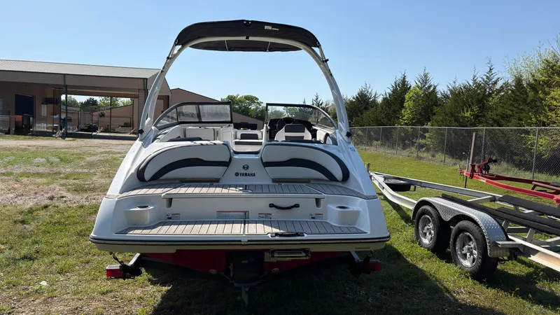 Slide: The Image of 2024 Yamaha Boats AR195 interior with cushioned seating and speakers, showcasing modern design. - 14