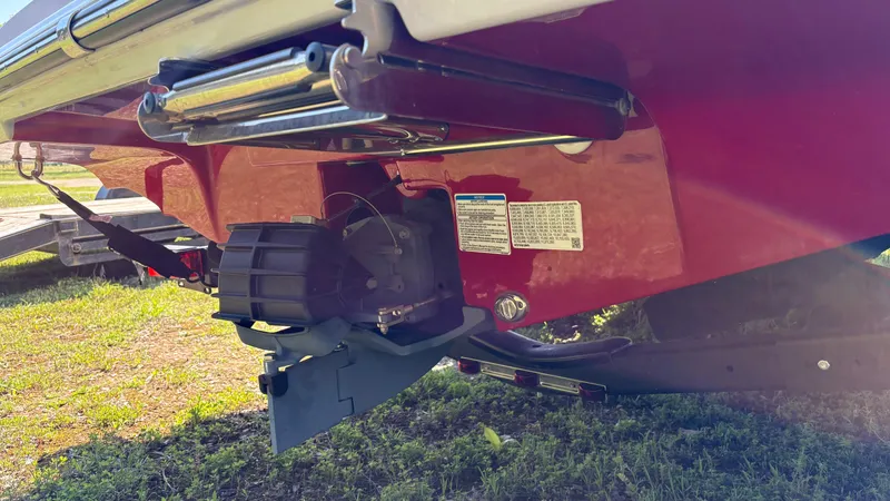 Slide: The Image of 2024 Yamaha AR195 boat jet drive system, close-up view, on grassy surface. - 19