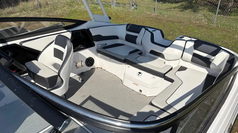 Slide: The Image of 2024 Yamaha Boats AR195 with canopy, sleek interior, and modern design. - 26